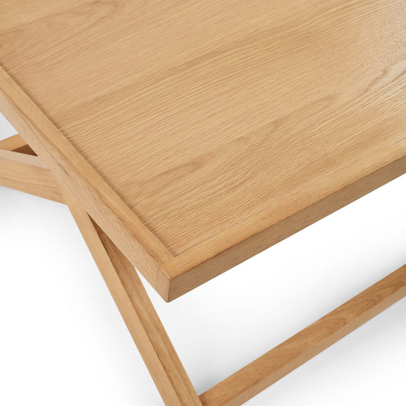 Wooden coffee table with a light finish on a white background