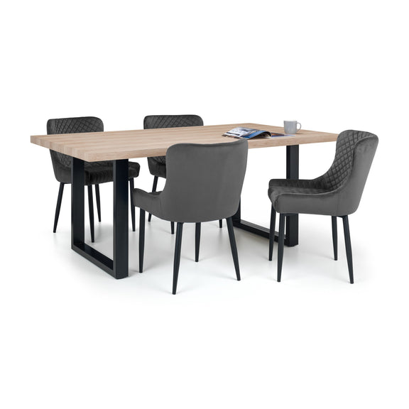 Dining table set with four gray chairs on a white background
