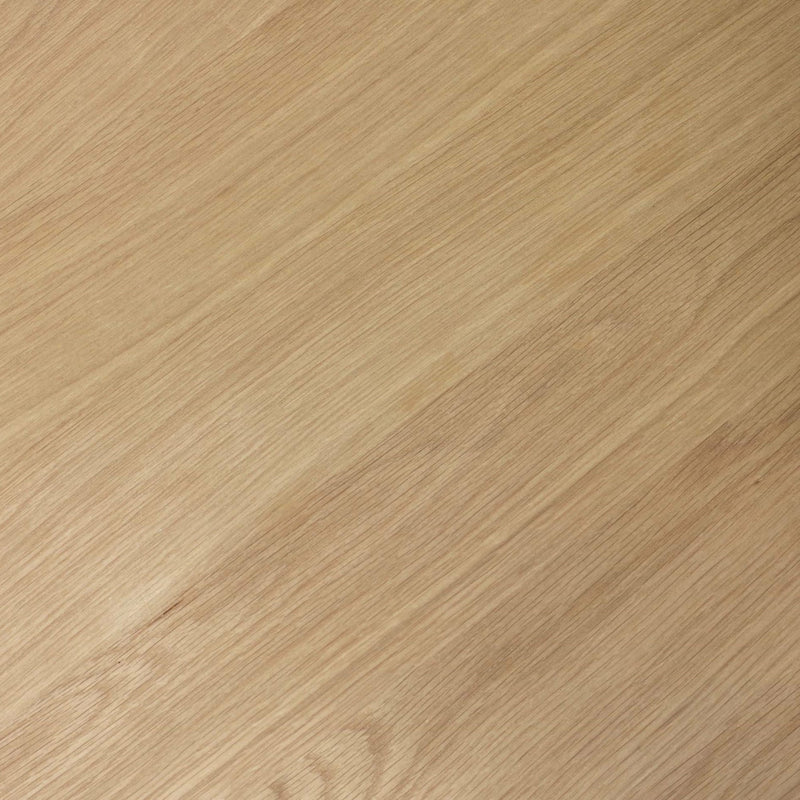 Close-up of a wooden surface with a light brown color and visible grain pattern.