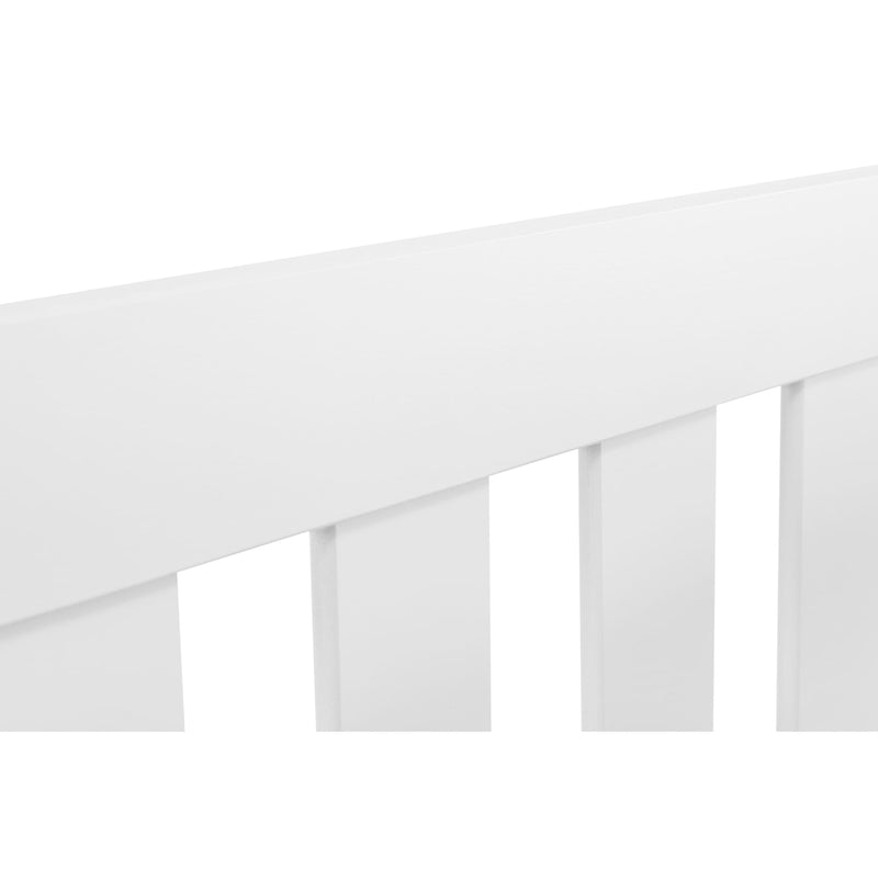 White crib with a simple design on a white background