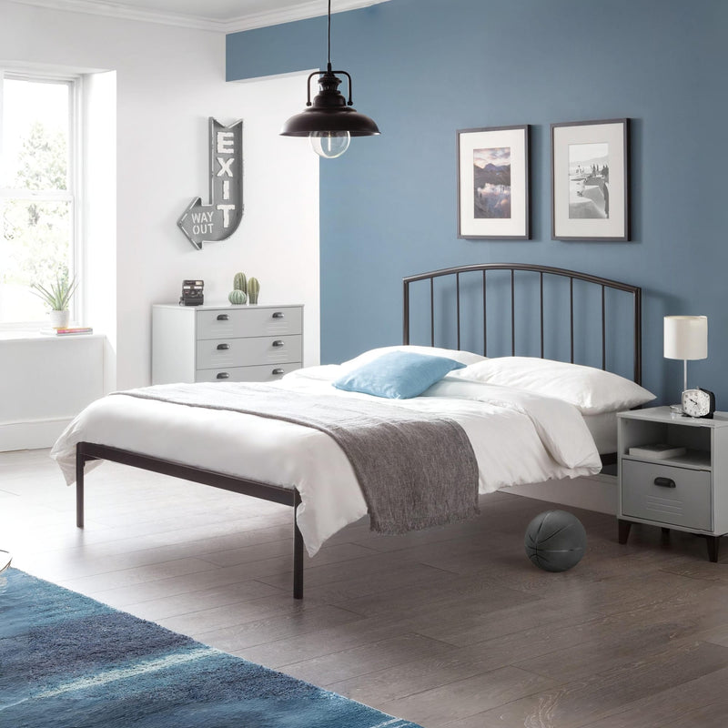 Modern bedroom with a metal bed, white bedding, and blue walls.