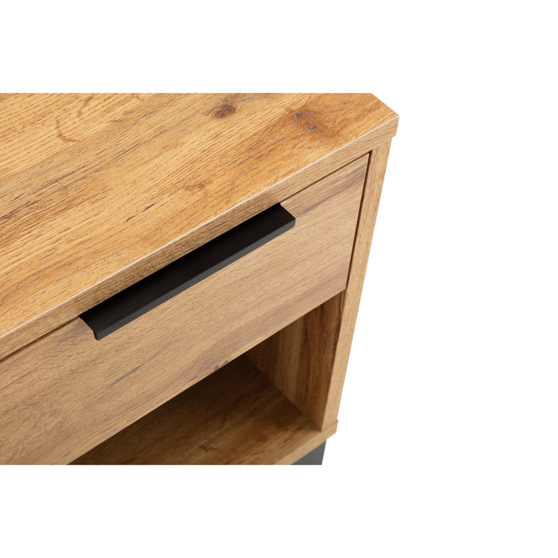 Wooden drawer unit with a light brown finish on a white background