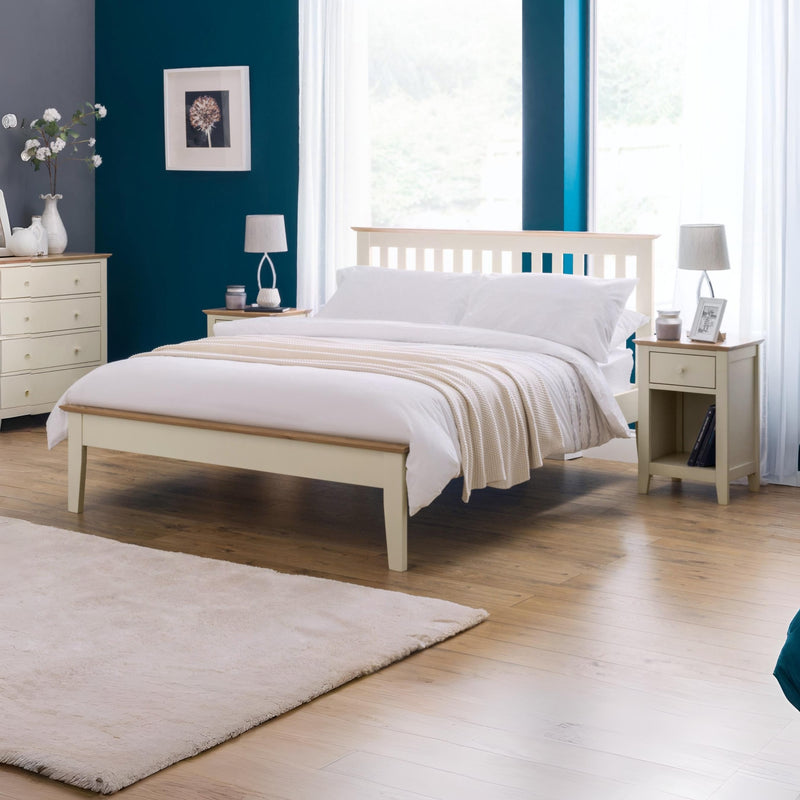 Bedroom with a wooden bed, nightstands, and lamps.