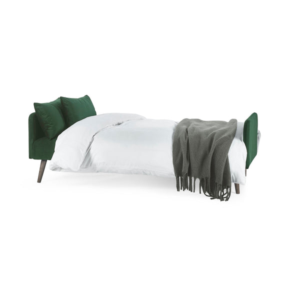 Bed with green headboard and gray blanket on a white background