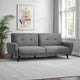 Gray sofa in a room with a colorful abstract painting on the wall and a plant.