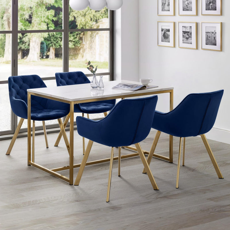 Dining room with a table and four blue chairs in a well-lit room.