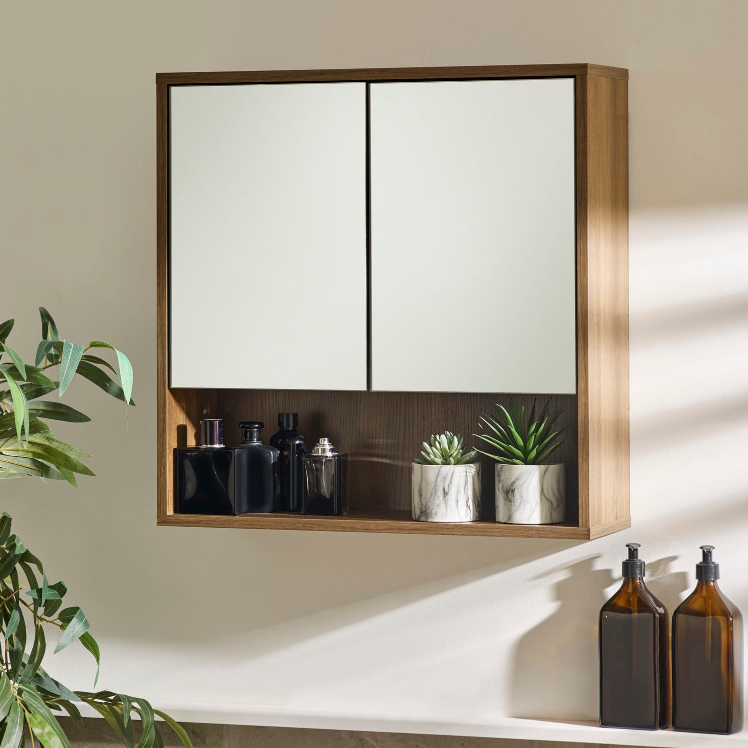 Wall-mounted cabinet with decorative items on a neutral wall