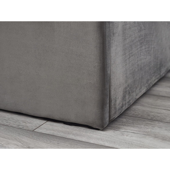Gray textured box on a wooden floor