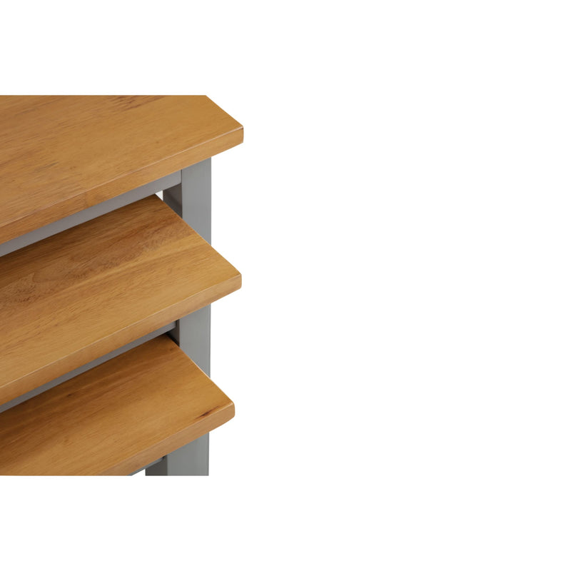 Wooden shelf unit with three shelves on a white background