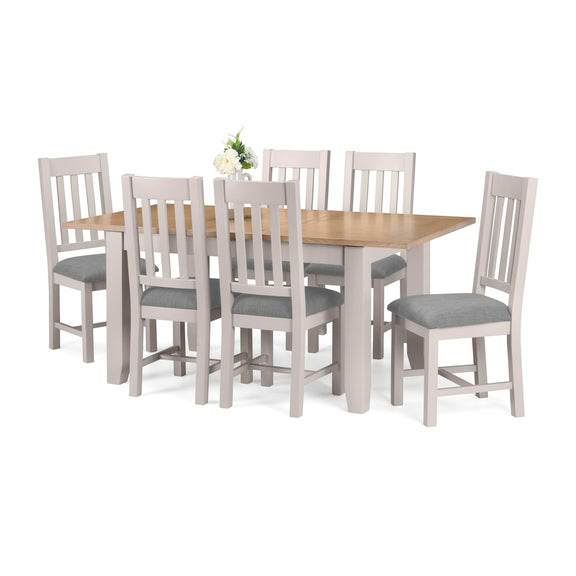 Dining table set with six chairs on a white background
