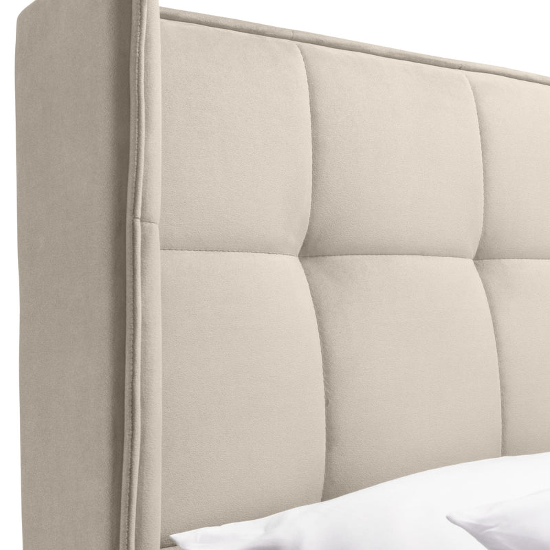 Beige upholstered headboard with tufted design on a white background