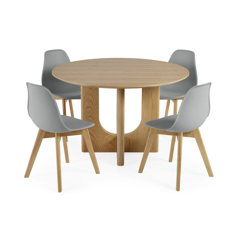 Round wooden table with four gray chairs on a white background