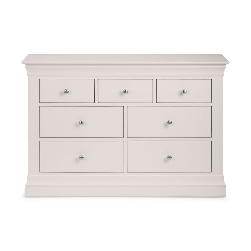 White dresser with multiple drawers on a white background