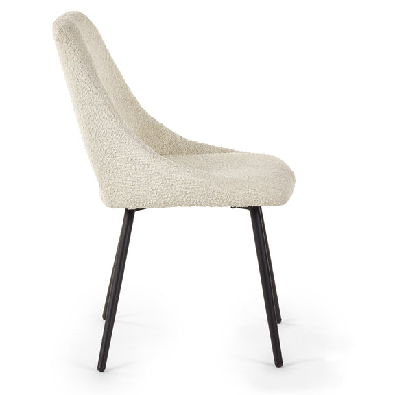 Beige upholstered chair with black legs on a white background