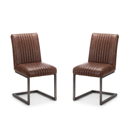 Two brown leather chairs with metal frames on a white background