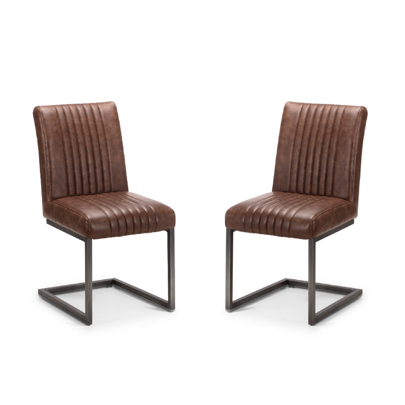 Two brown leather chairs with metal frames on a white background