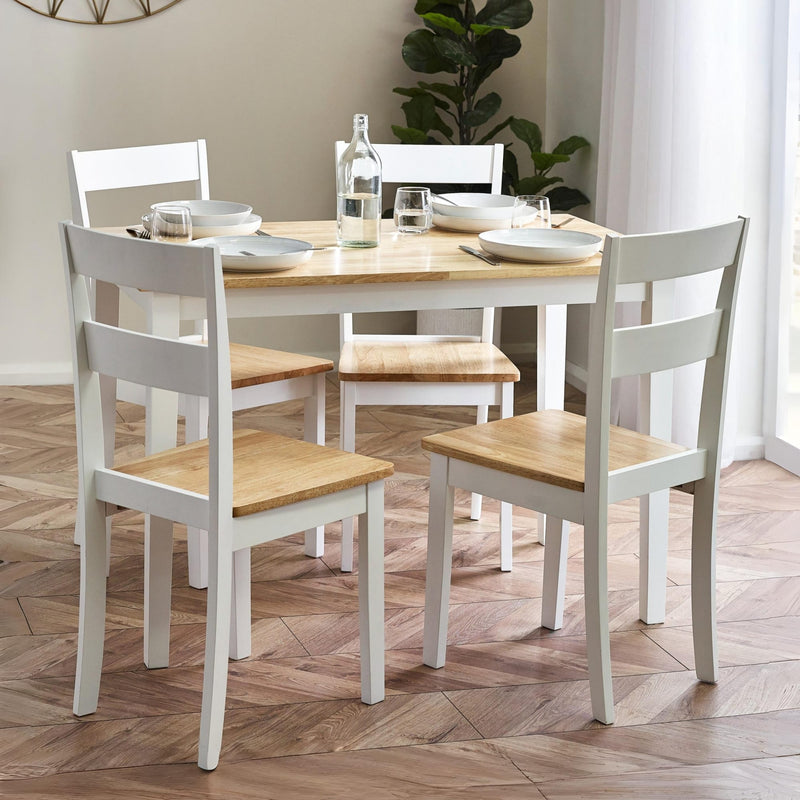 Dining table set with chairs on a wooden floor