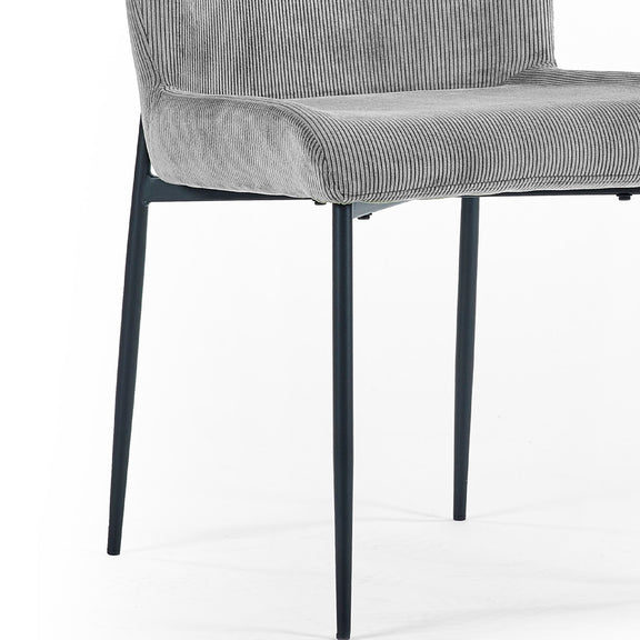 Gray upholstered chair with black metal legs on a white background