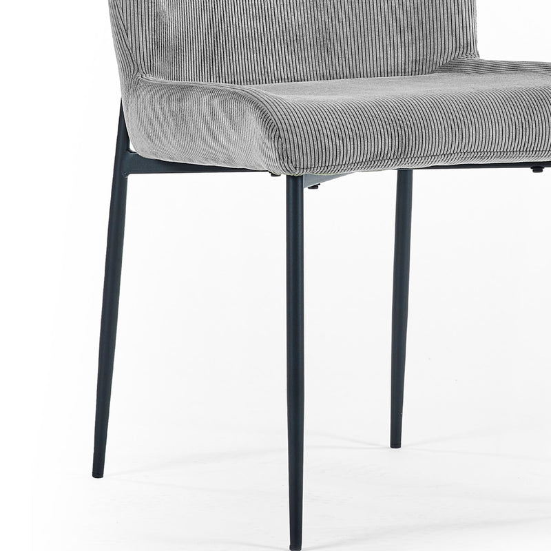 Gray upholstered chair with black metal legs on a white background