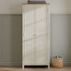 White wardrobe with wooden top against a neutral wall