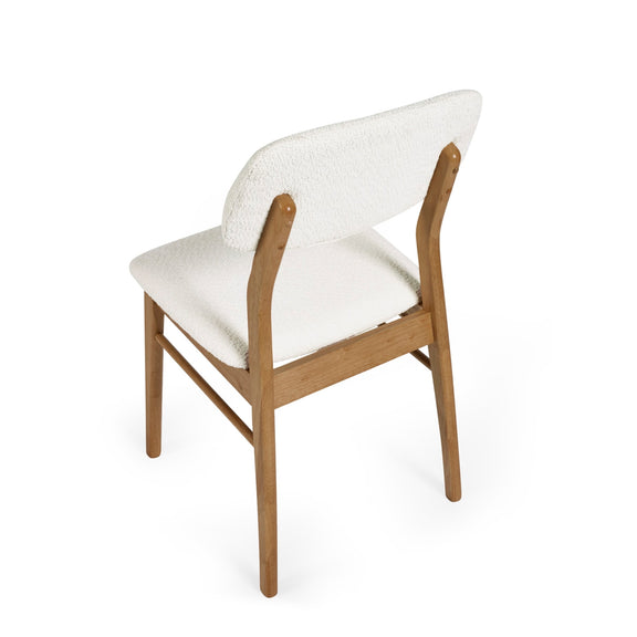 Chair with white cushioned backrest and seat on a white background
