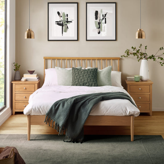 Bedroom with wooden bed, nightstands, and abstract art on the wall.