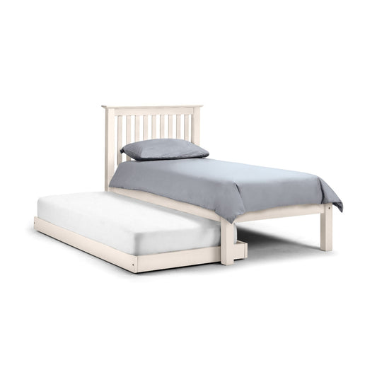 White wooden bed with gray bedding on a white background