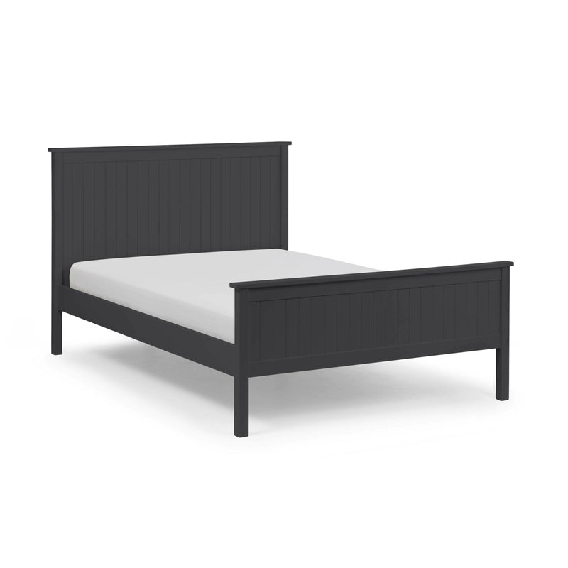 Black bed frame with white mattress on a light gray background