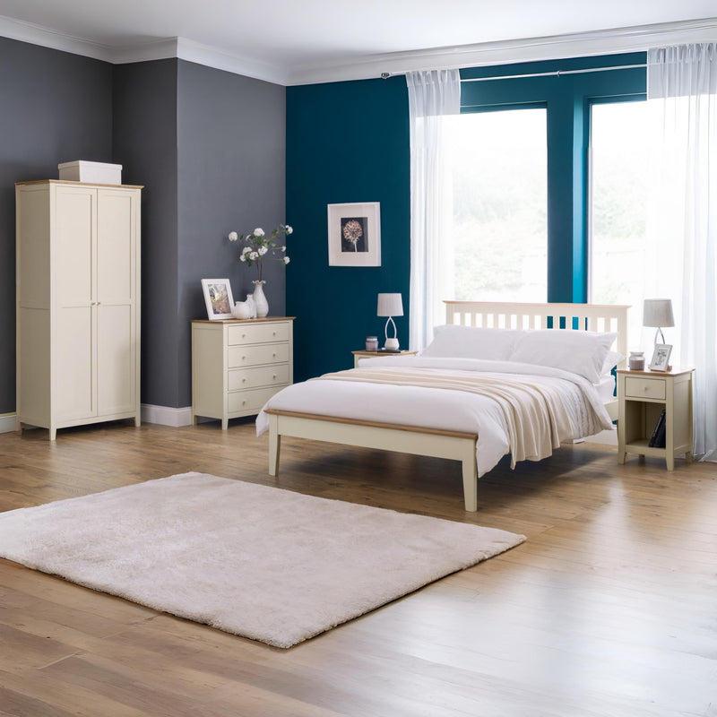 Neatly arranged bedroom with a bed, wardrobe, and dresser.