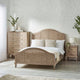 Bedroom with wooden bed, nightstands, and dresser against a light wall.