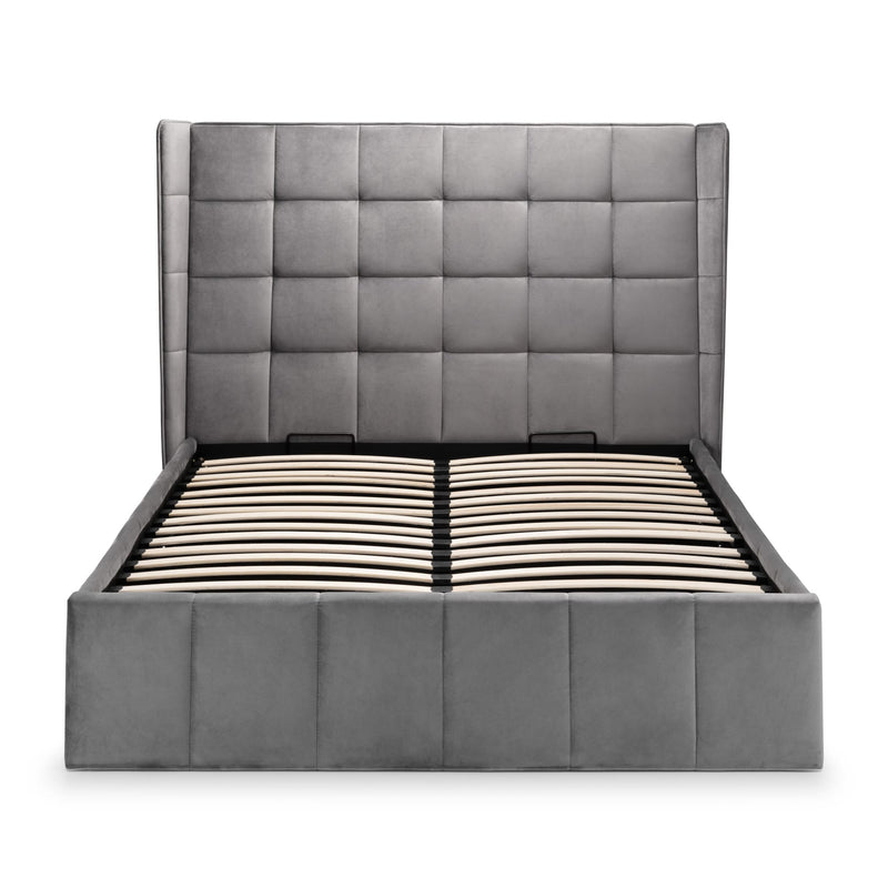 Gray upholstered bed with tufted headboard on a white background