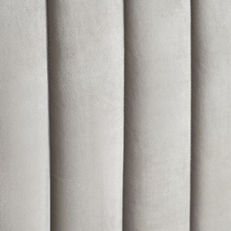 Close-up of gray textured fabric with vertical pleats