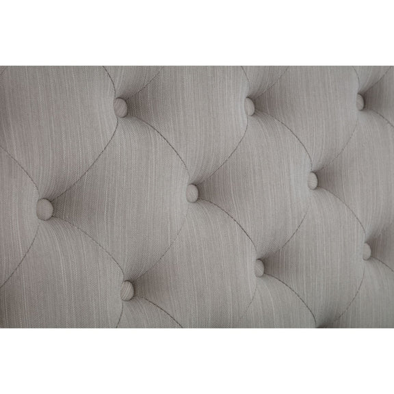 Textured gray headboard with tufted design