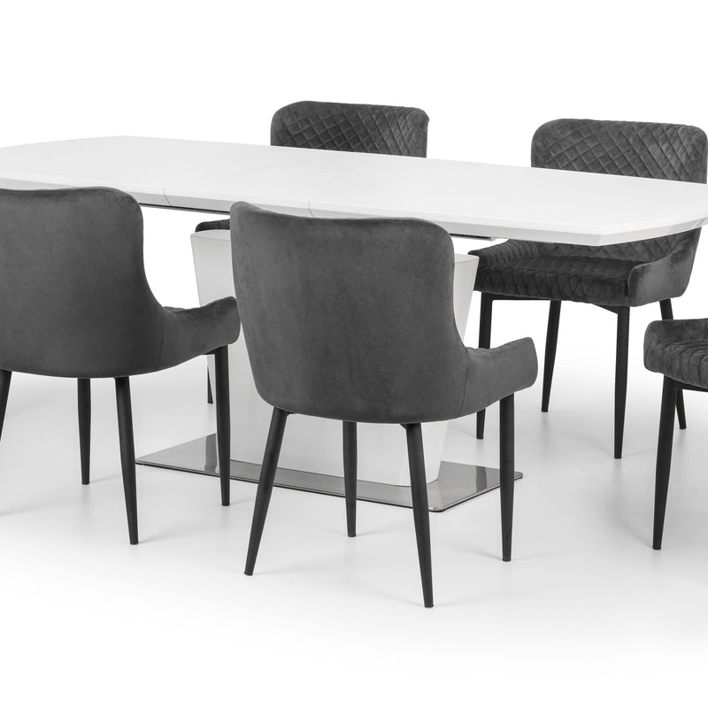 White dining table with gray chairs on a white background
