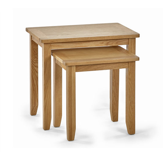 Two wooden nesting tables on a white background