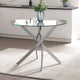 Glass dining table with metal legs in a kitchen setting
