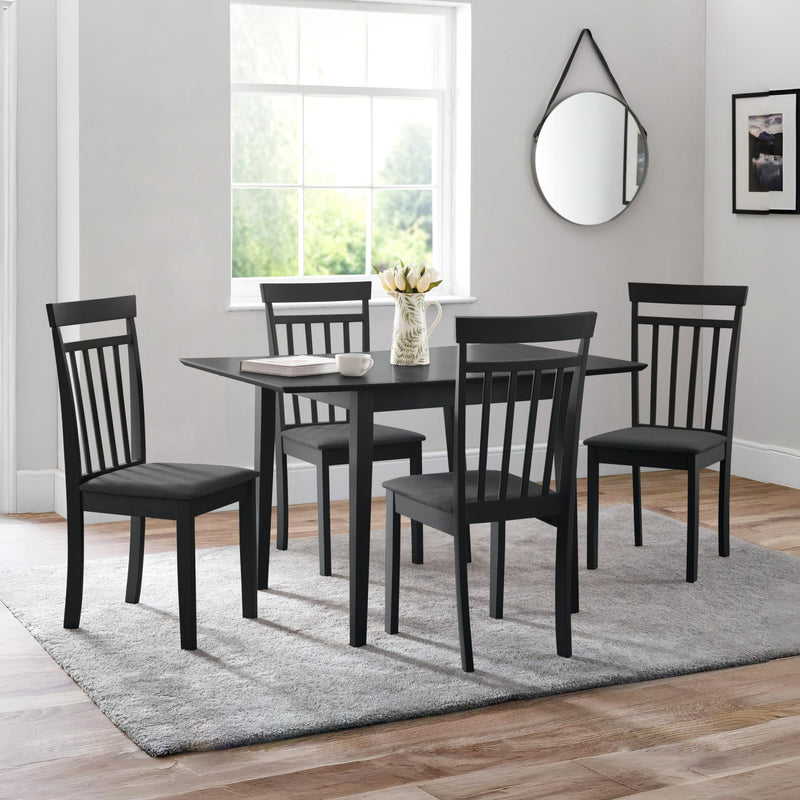 Black dining set with table and chairs in a room with a window and mirror.