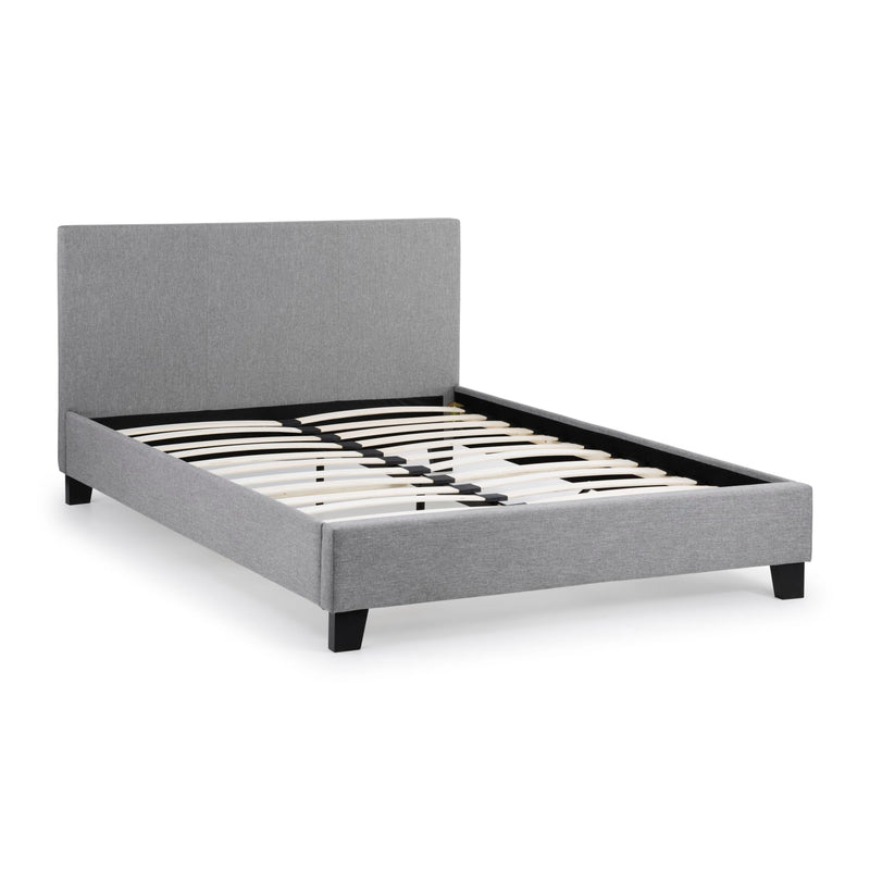 Gray upholstered bed frame on a white background