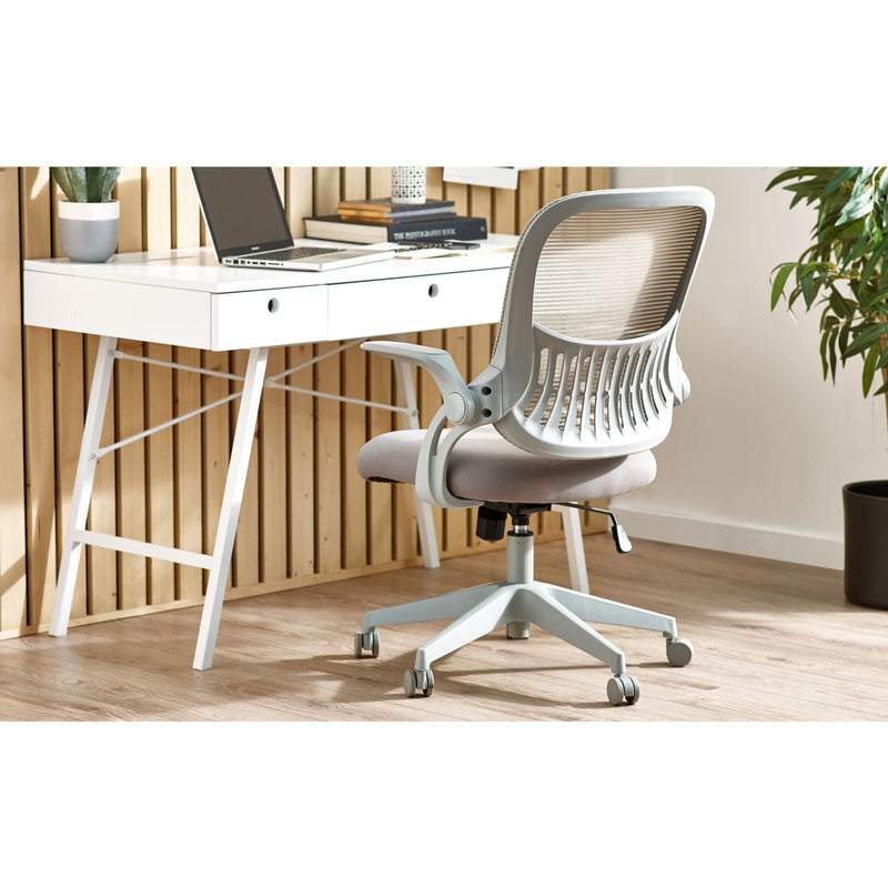 White office desk with a chair and laptop in a home office setting