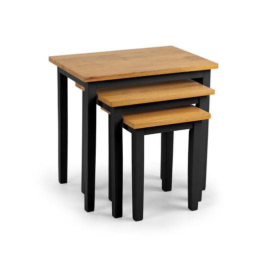 Set of three nesting tables with wooden tops and black bases on a white background