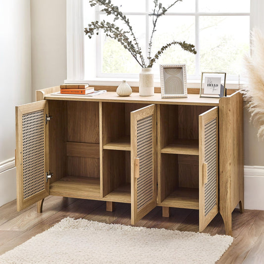Wooden cabinet with open doors in a room with a window and decor items.