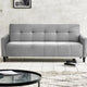 Gray sofa in a living room setting with a coffee table and books.