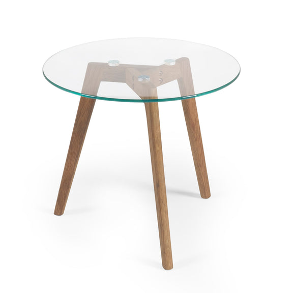 Round glass table with wooden legs on a white background