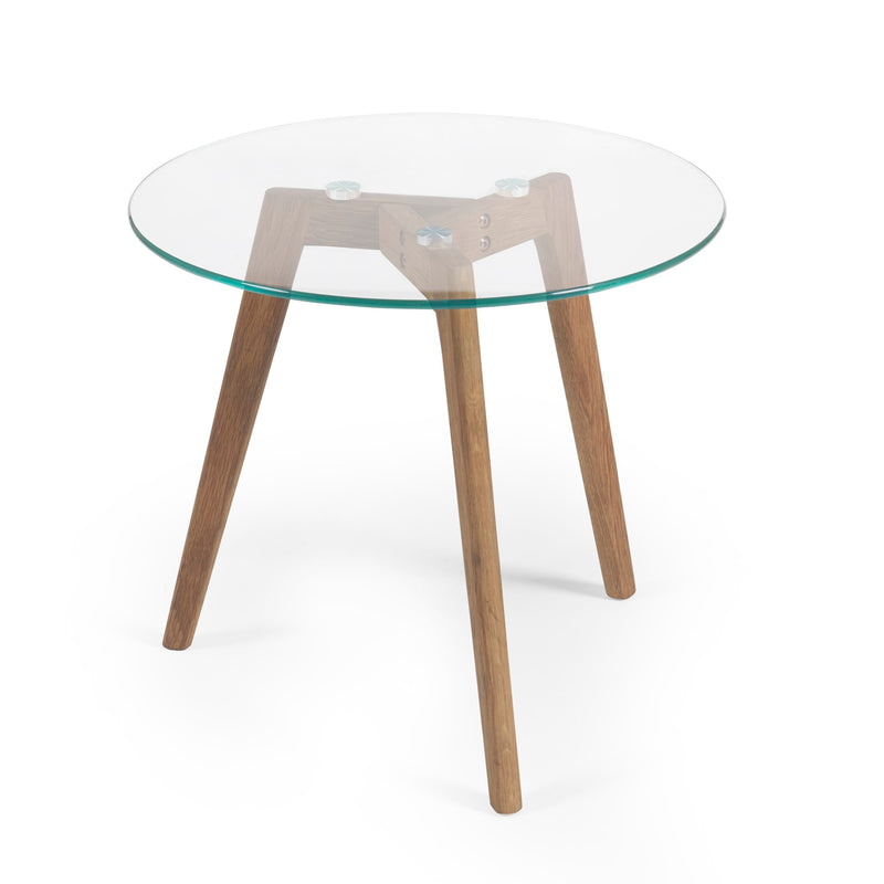 Round glass table with wooden legs on a white background