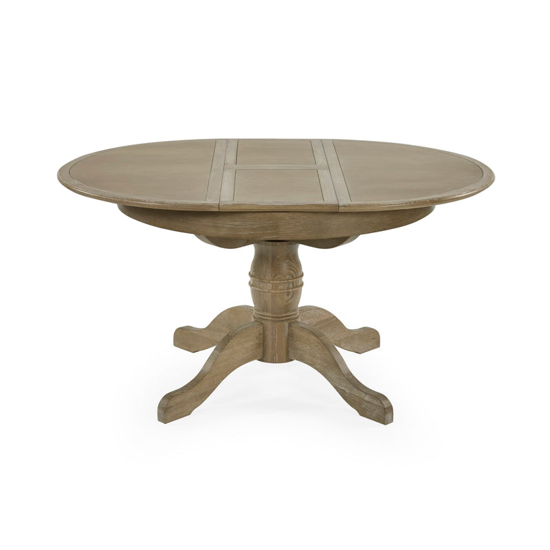 Round wooden dining table with a pedestal base on a white background