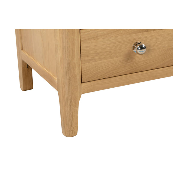 Wooden drawer with a silver handle on a white background