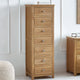 Tall wooden dresser with multiple drawers in a room setting