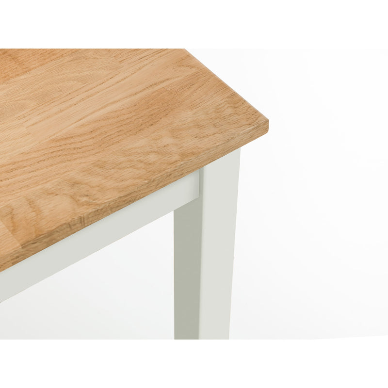 Wooden table top with white legs on a white background