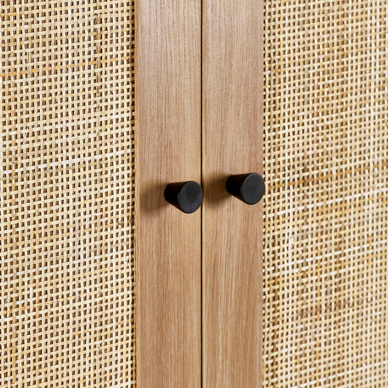 Wooden cabinet with black knobs against a textured beige background
