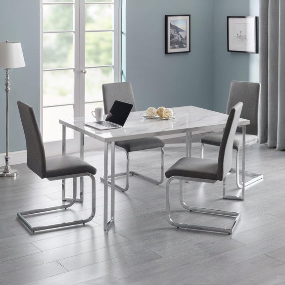 Dining room with a table and chairs in a modern interior setting.